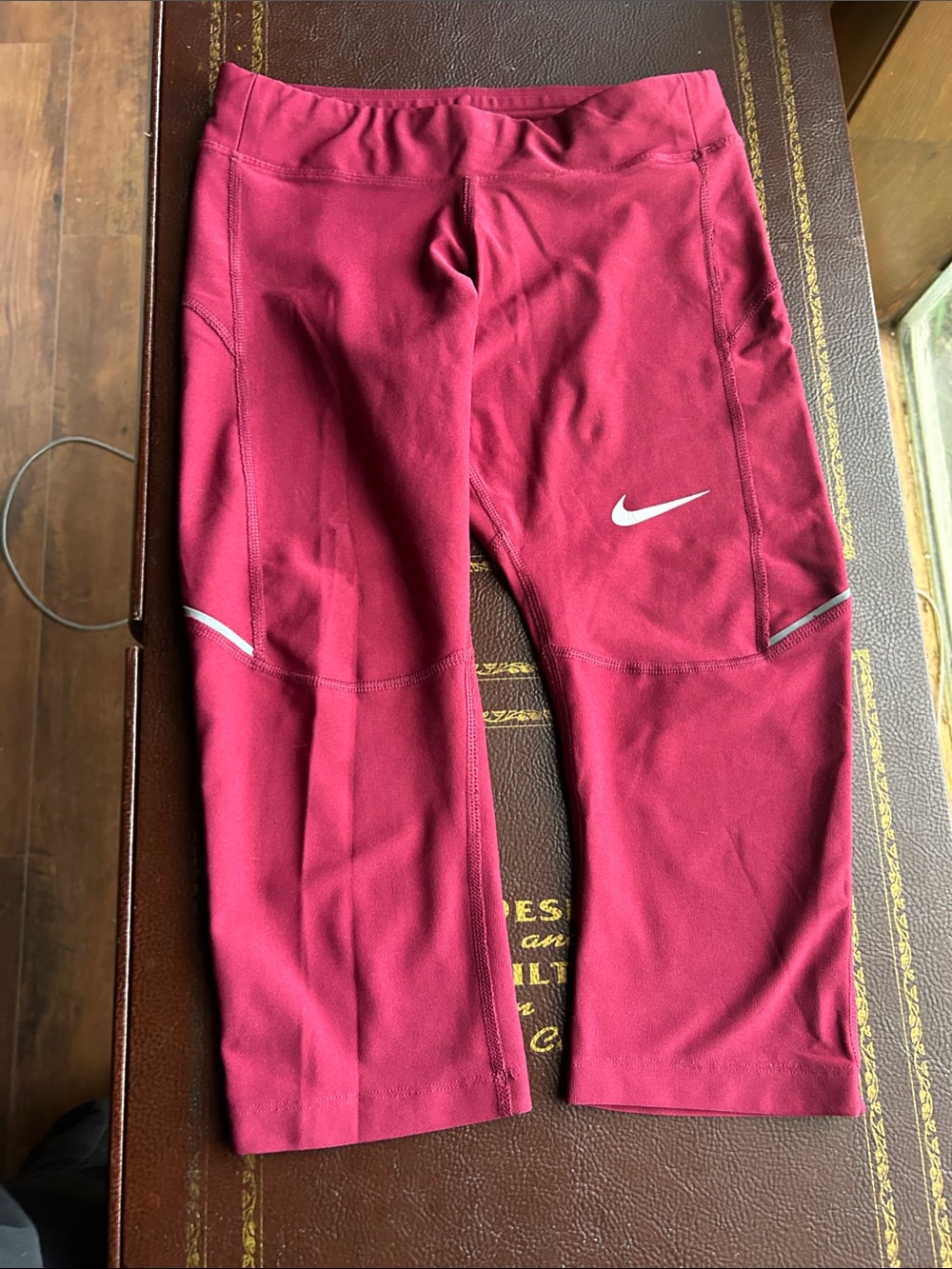 Nike women’s Burgundy Capri Leggings with White Swoosh
